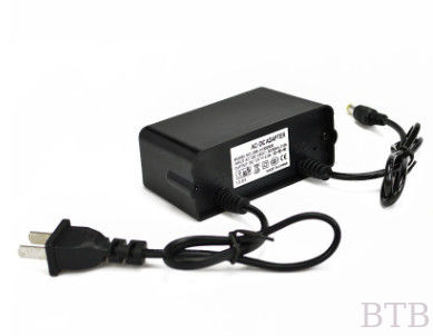 Adaptador de alimentación de conmutación 12V 2A, piezas de entrada de gran voltaje impermeable a la lluvia, con enchufe europea y estadounidense para cámara de CCTV proveedor